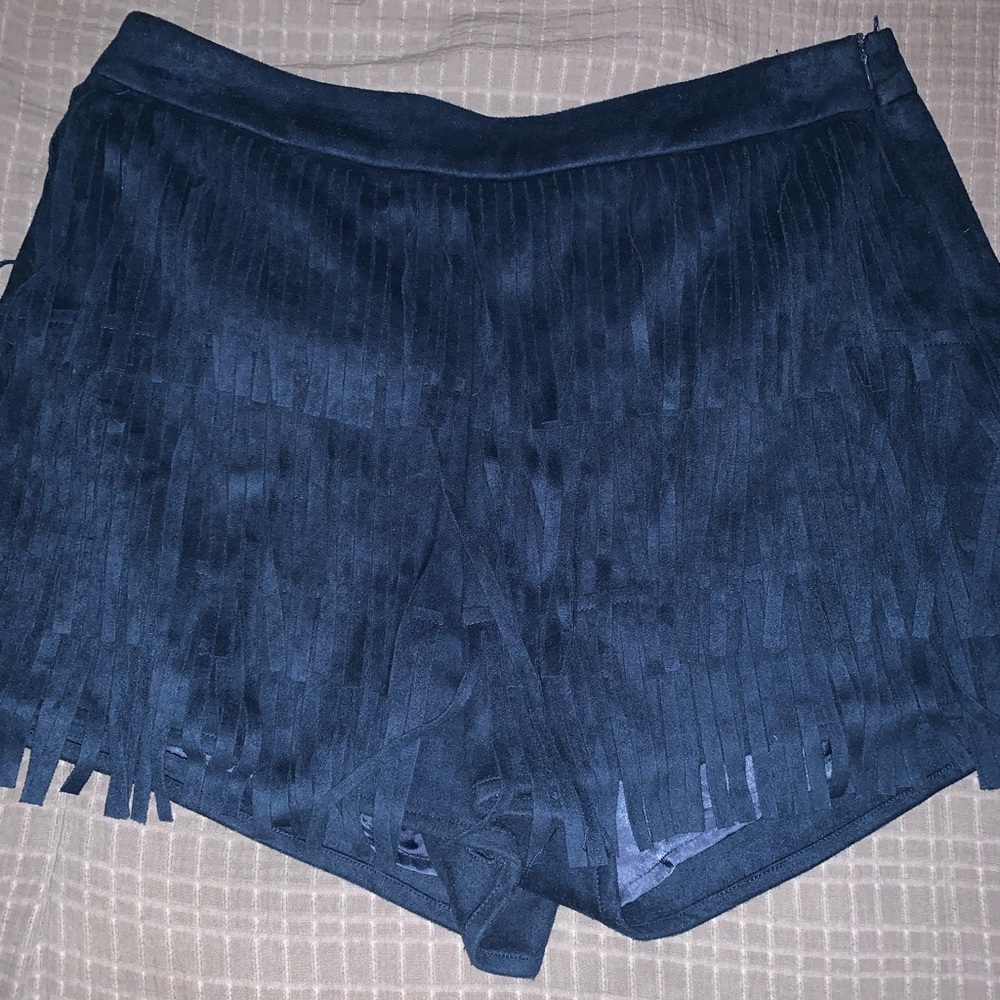 Royal blue high waisted fringe shorts.